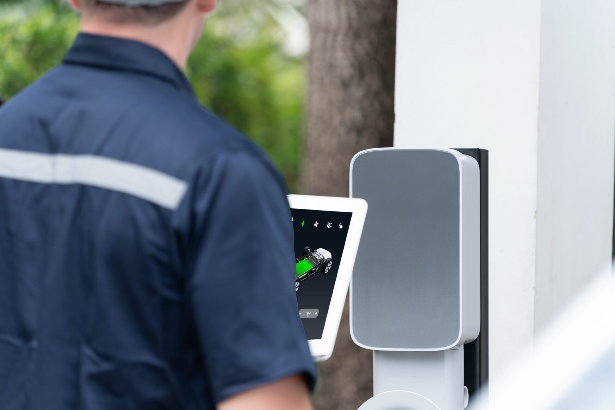 Qualified technician install home EV charging station. Synchronos