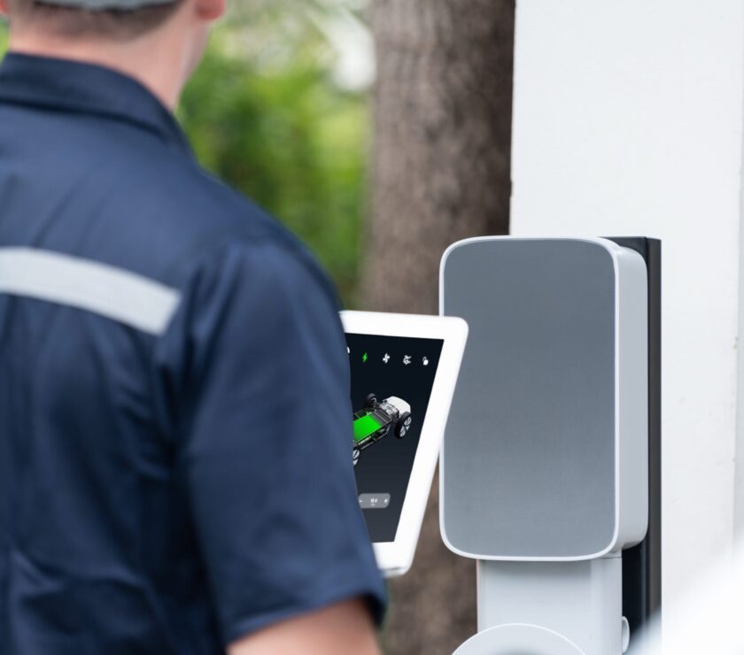 Qualified technician install home EV charging station. Synchronos